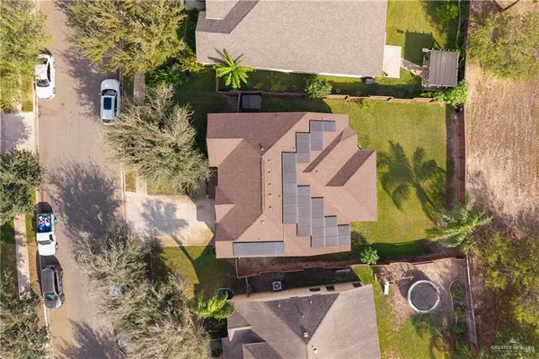 an aerial view of houses with yard