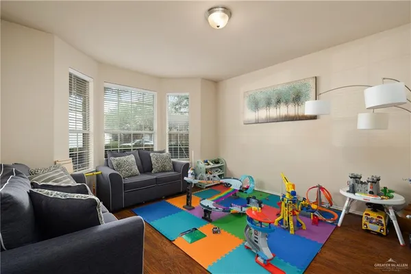 a living room with furniture and a window