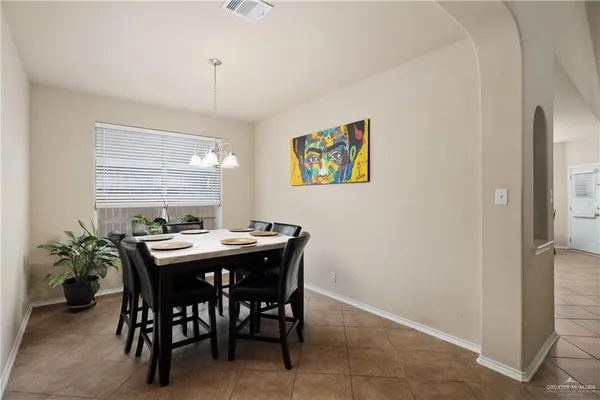 a view of a dining room with furniture and window