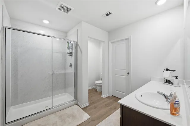 a bathroom with a double vanity sink and mirror