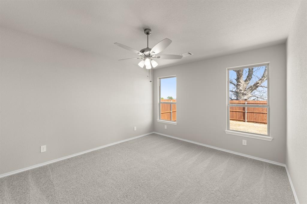 8224 Kingfisher Road Pilot Point, TX 76258 - Photo 18 of 27 a view of an empty room with a window