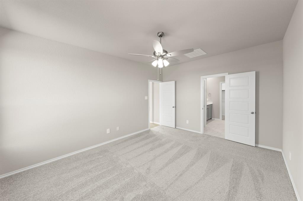8224 Kingfisher Road Pilot Point, TX 76258 - Photo 19 of 27 a view of an empty room with a ceiling fan