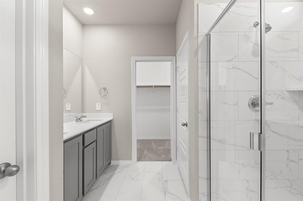 8224 Kingfisher Road Pilot Point, TX 76258 - Photo 20 of 27 a bathroom with a shower and a sink