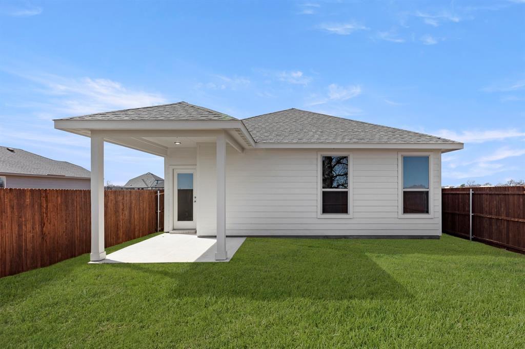 8224 Kingfisher Road Pilot Point, TX 76258 - Photo 26 of 27 a front view of house with yard and green space
