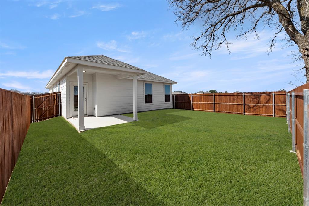 8224 Kingfisher Road Pilot Point, TX 76258 - Photo 27 of 27 a view of a house with a garden