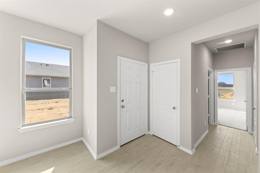 8224 Kingfisher Road Pilot Point, TX 76258 - Photo 3 of 27 a view of an empty room and window