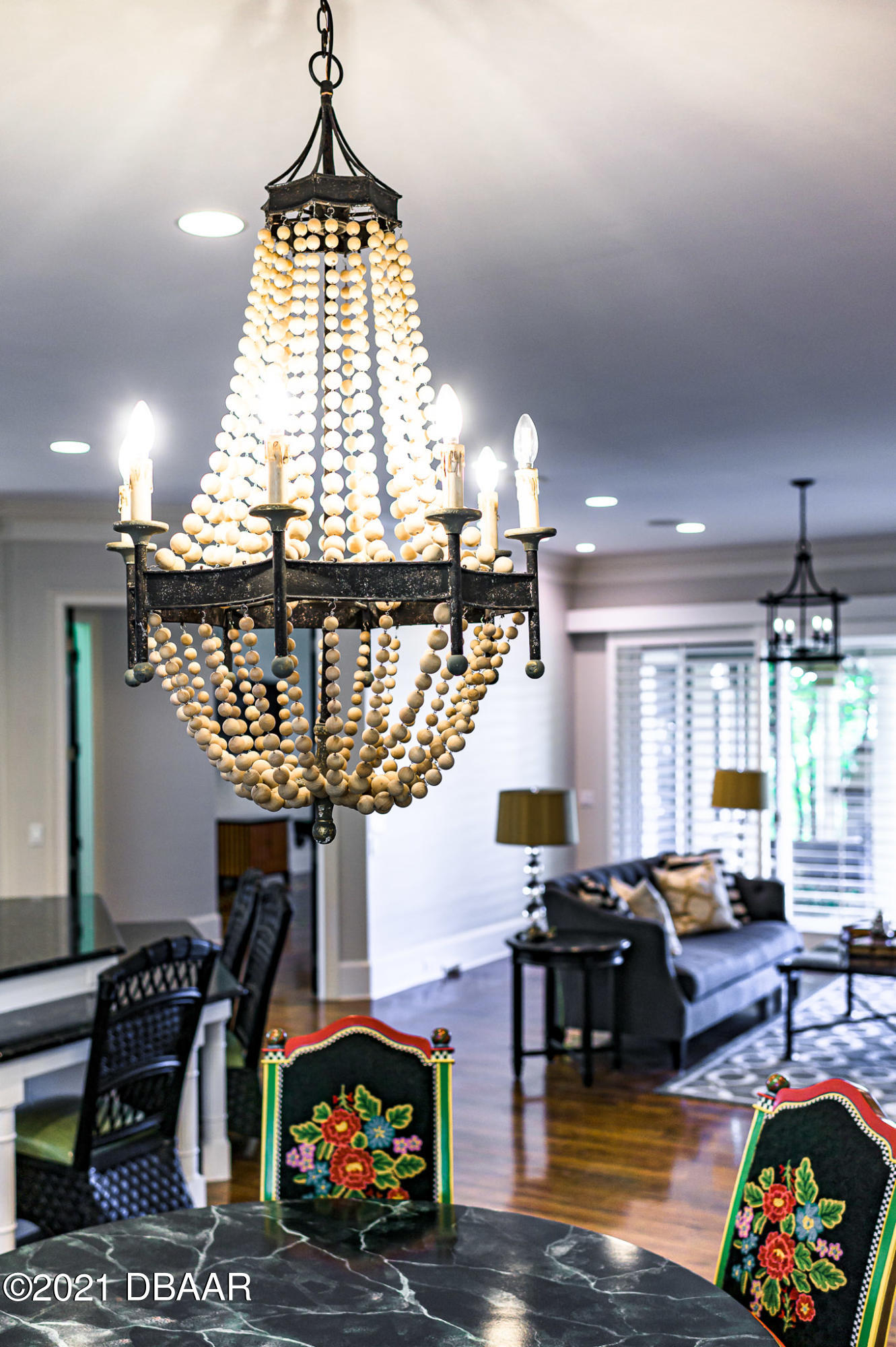 300 Riverside Drive Ormond Beach, FL 32176 - Photo 14 of 72 a living room with fireplace furniture and a chandelier