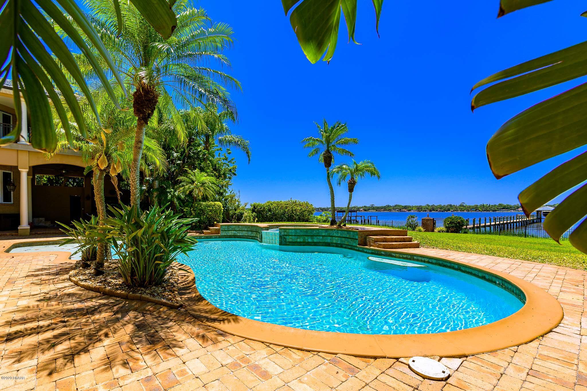 300 Riverside Drive Ormond Beach, FL 32176 - Photo 35 of 72 a view of a swimming pool with an outdoor space