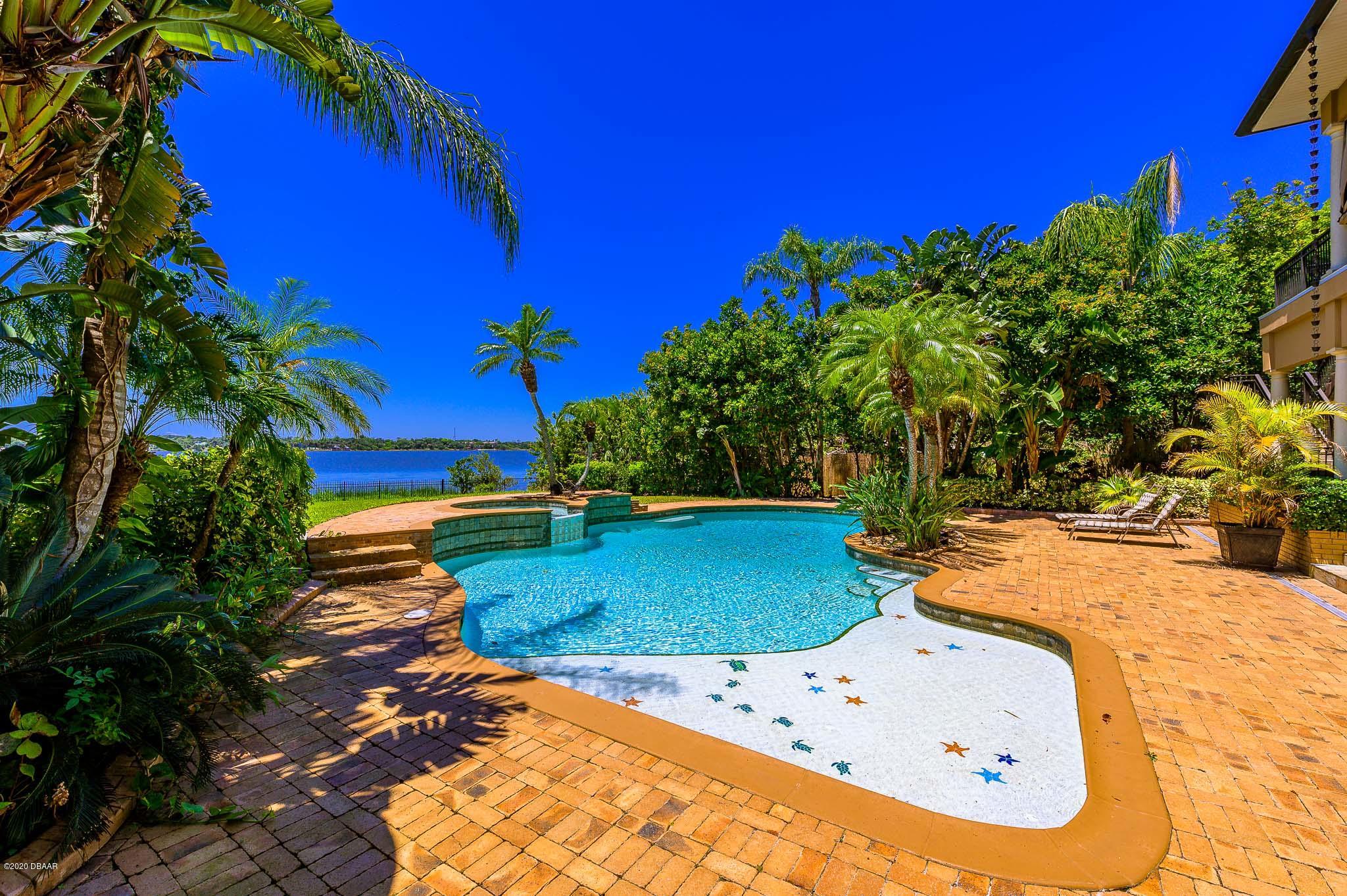 300 Riverside Drive Ormond Beach, FL 32176 - Photo 36 of 72 a view of a swimming pool with an outdoor space