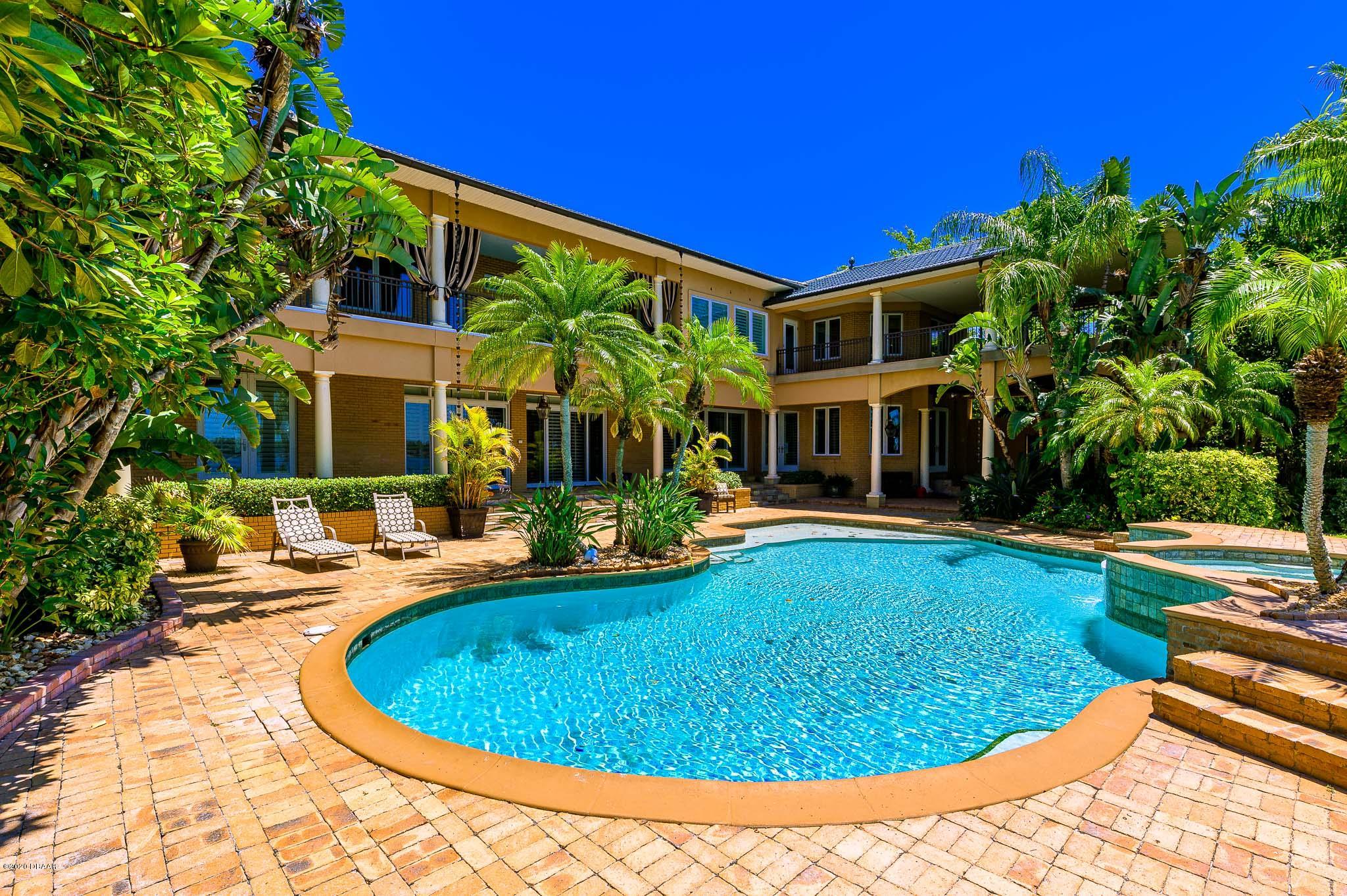 300 Riverside Drive Ormond Beach, FL 32176 - Photo 39 of 72 a view of a house with swimming pool