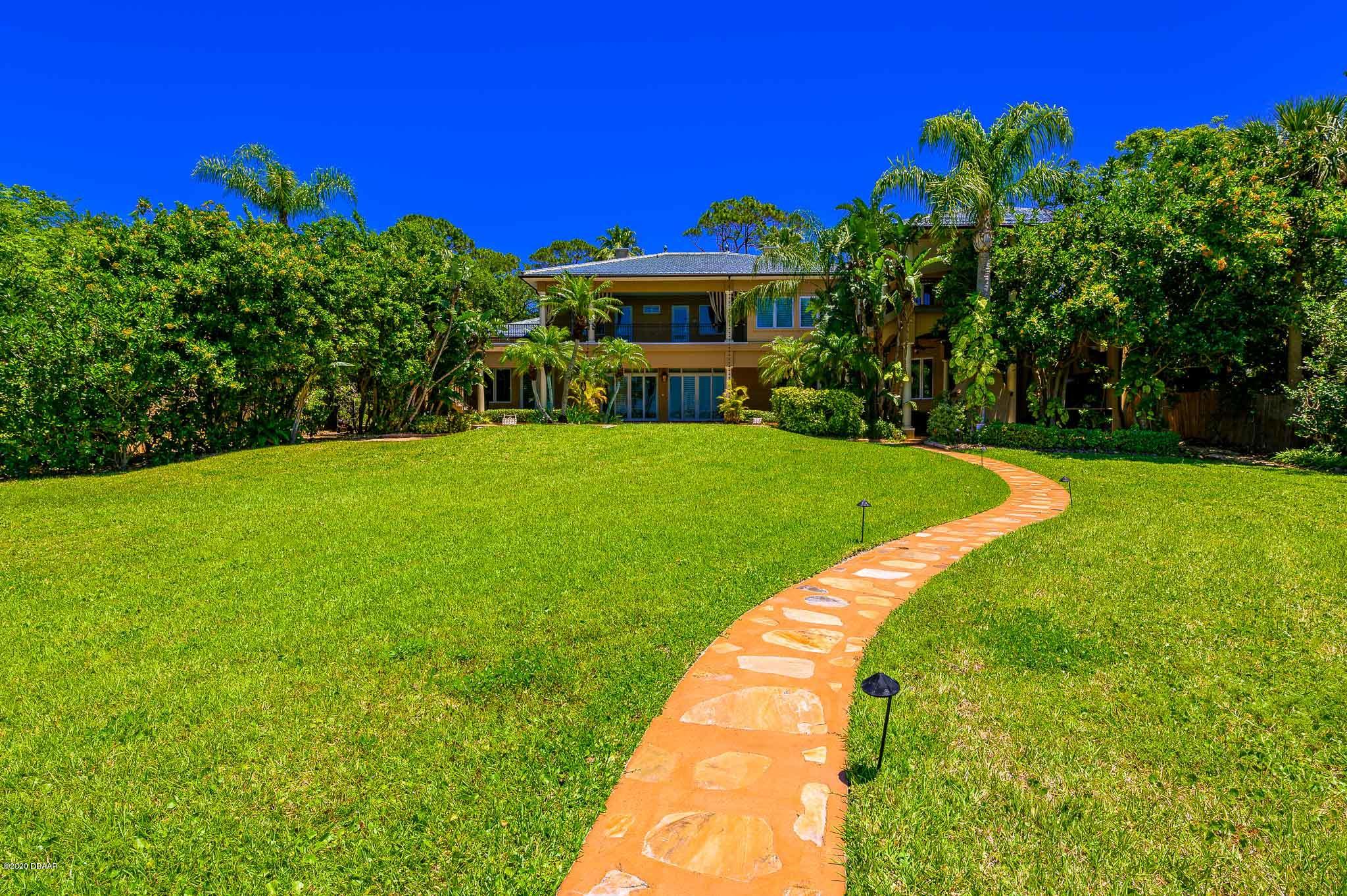 300 Riverside Drive Ormond Beach, FL 32176 - Photo 45 of 72 a view of a house with a yard