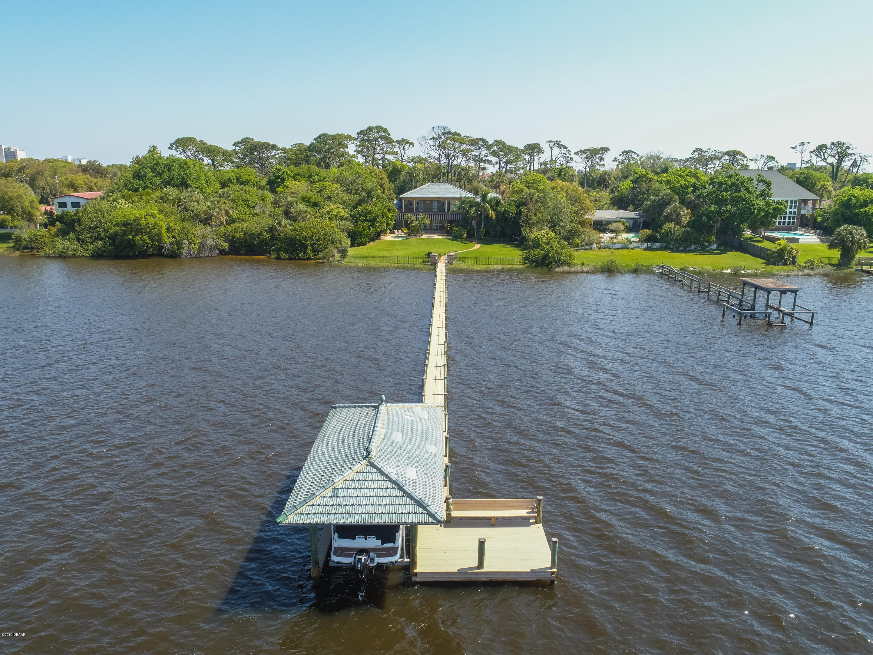 300 Riverside Drive Ormond Beach, FL 32176 - Photo 50 of 72 a view of a lake with a mountain in the back