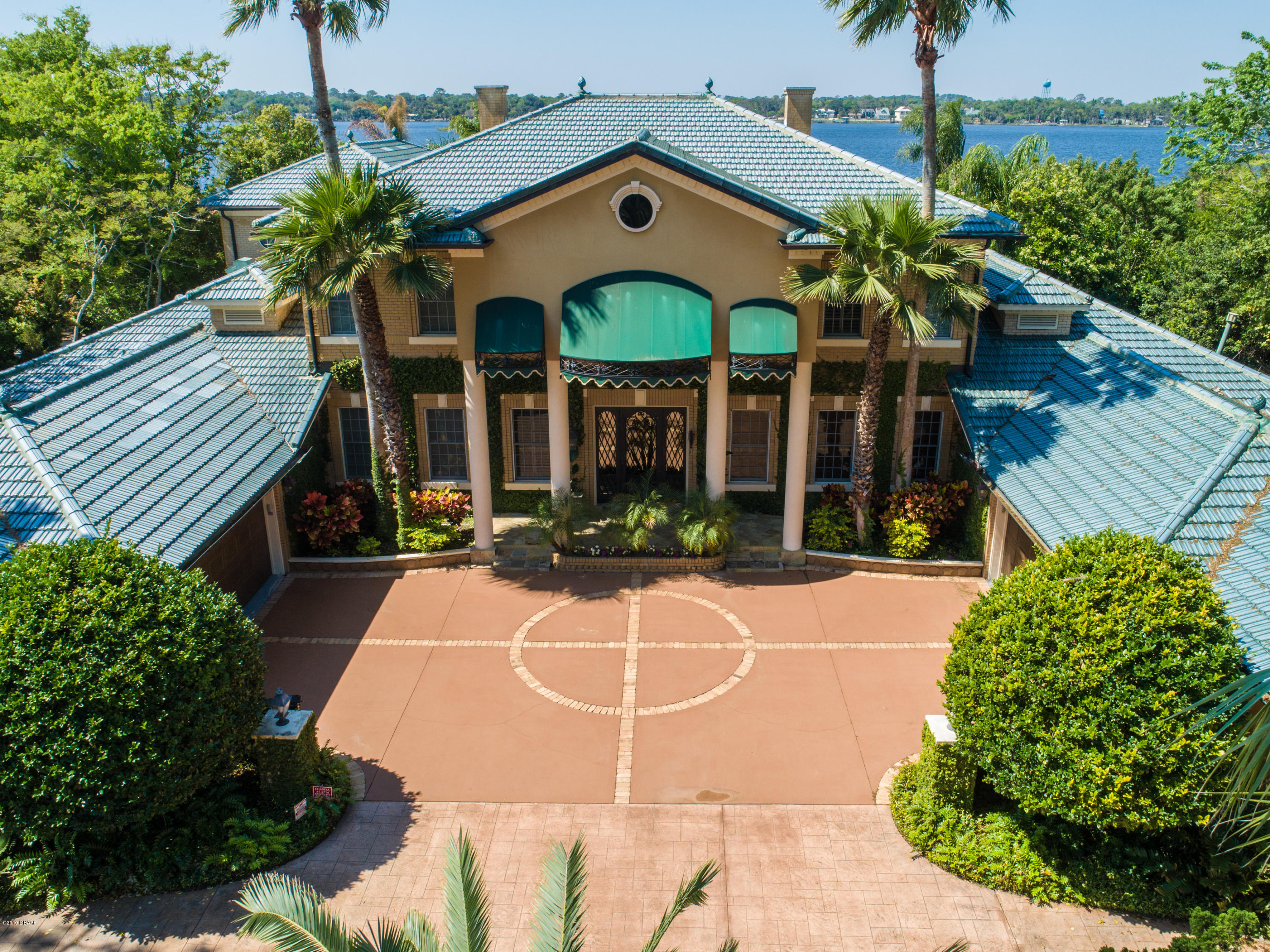 300 Riverside Drive Ormond Beach, FL 32176 - Photo 56 of 72 a front view of a house having yard