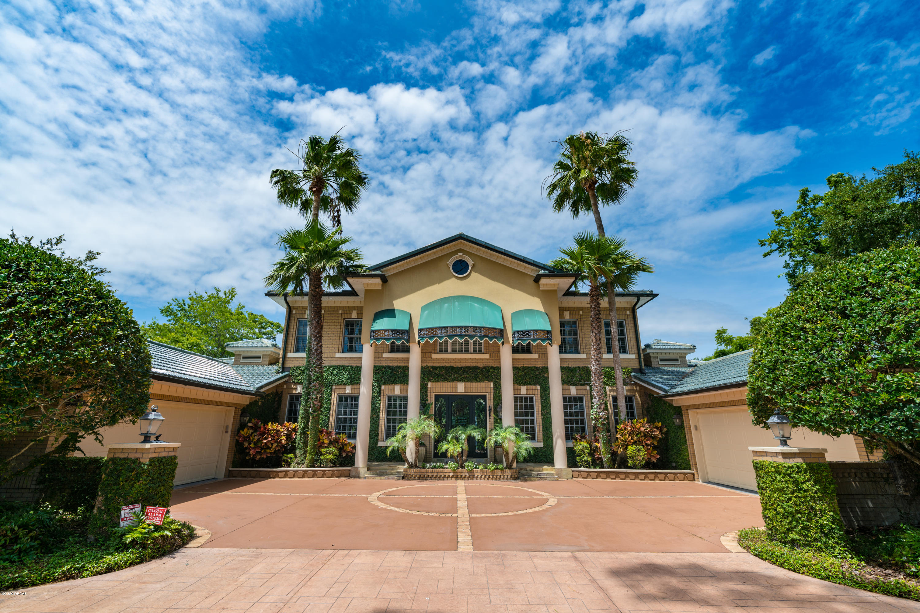 300 Riverside Drive Ormond Beach, FL 32176 - Photo 57 of 72 a view of a house with a yard and potted plants