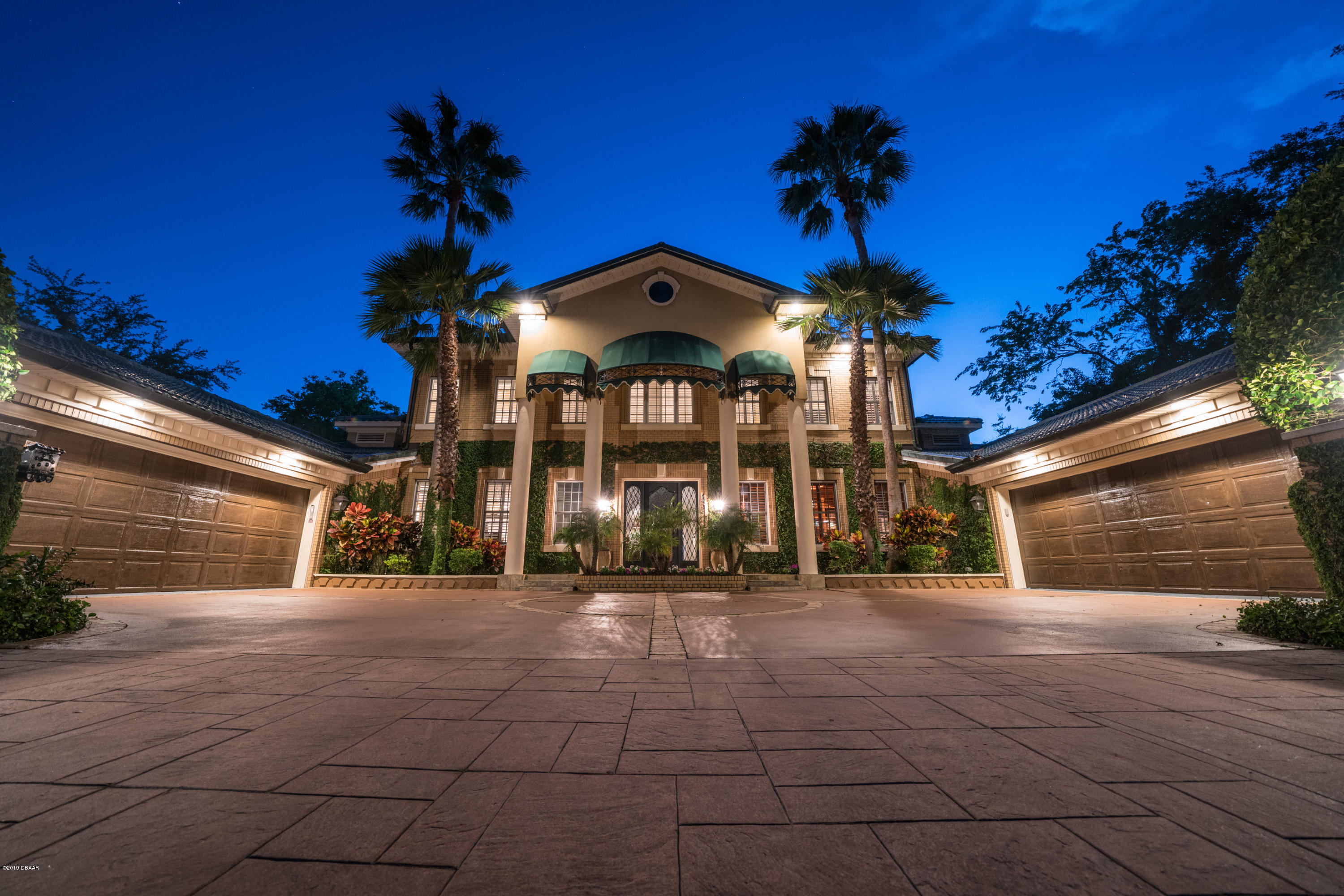 300 Riverside Drive Ormond Beach, FL 32176 - Photo 58 of 72 a view of a building with a yard