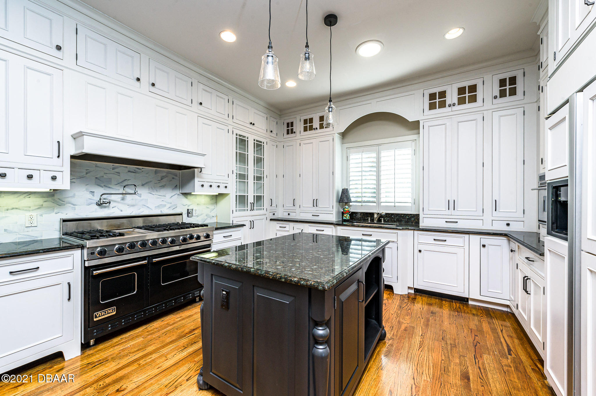 300 Riverside Drive Ormond Beach, FL 32176 - Photo 7 of 72 a kitchen with stainless steel appliances granite countertop a stove a sink and a refrigerator