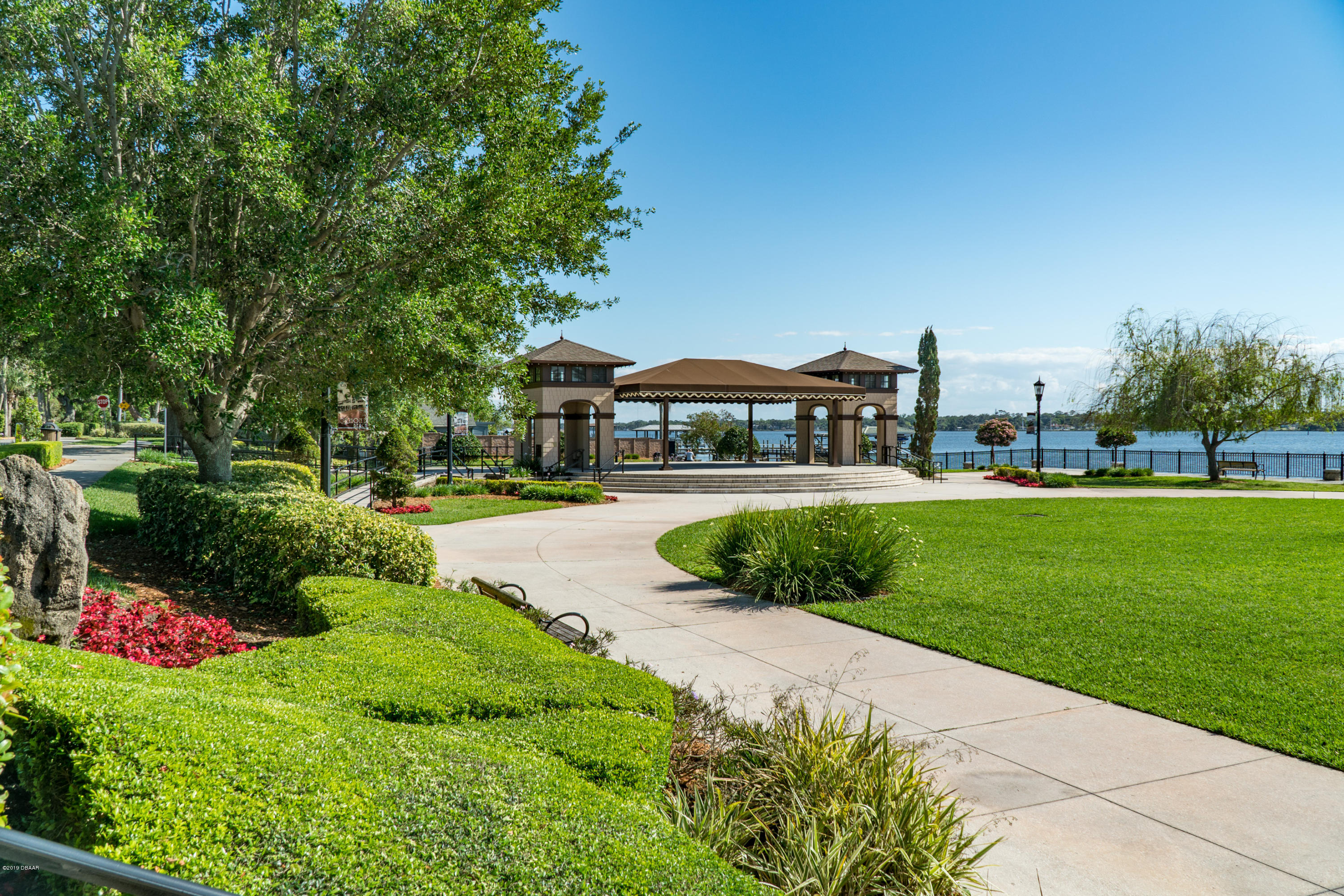 300 Riverside Drive Ormond Beach, FL 32176 - Photo 71 of 72 a view of a house with a garden and pathway