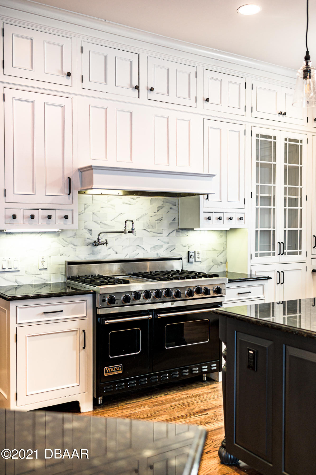 300 Riverside Drive Ormond Beach, FL 32176 - Photo 8 of 72 a kitchen with stainless steel appliances granite countertop a stove and a white cabinets