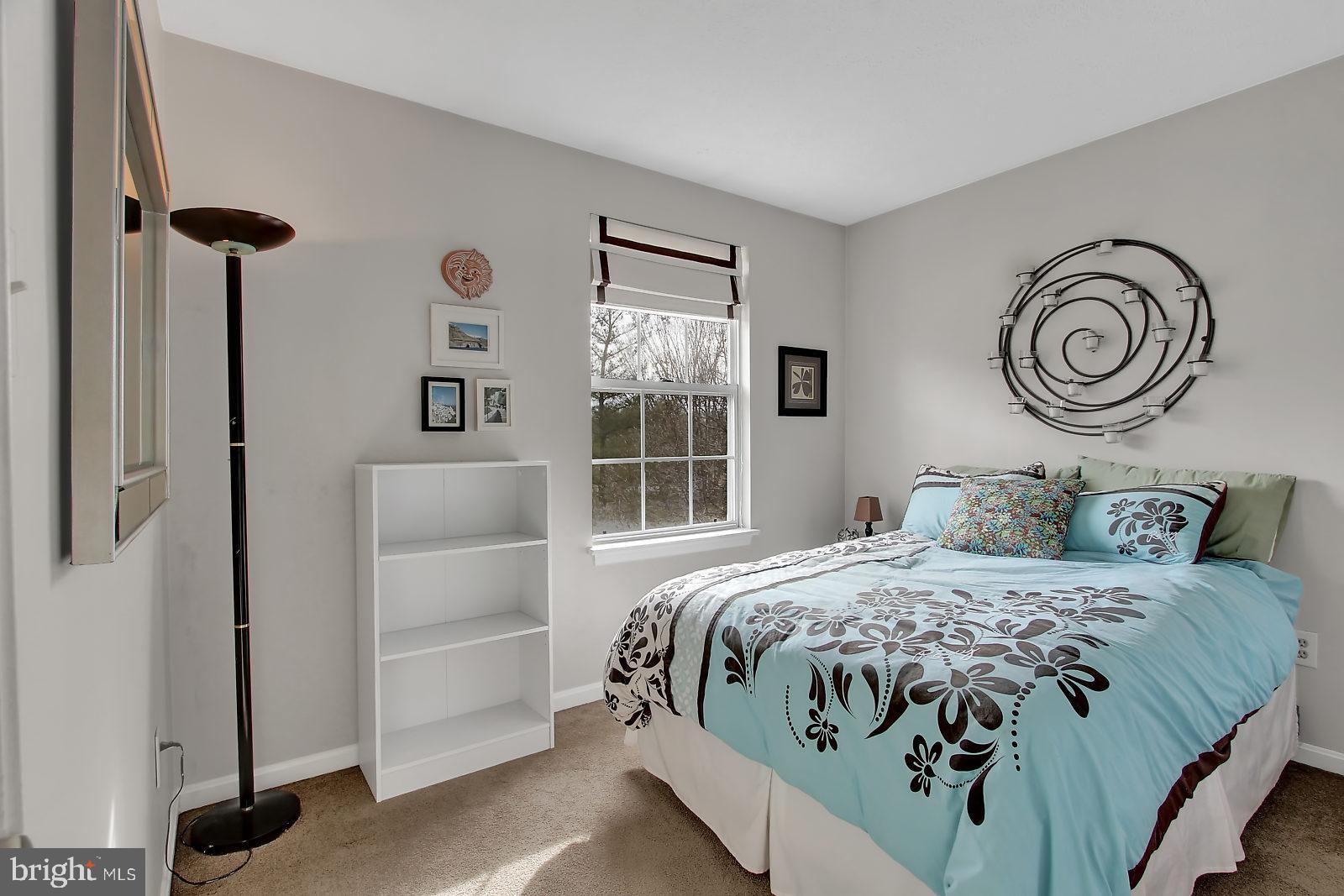 2101 Riding Crop Way Baltimore, MD 21244 - Photo 20 of 36 a bedroom with a bed and a window