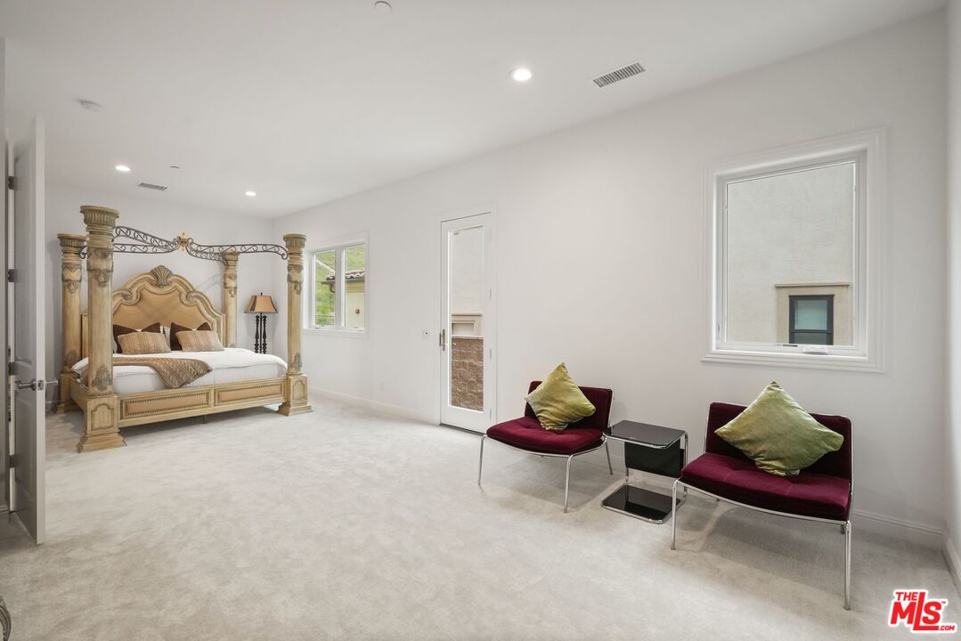 20244 Albion Way Porter Ranch, CA 91326 - Photo 16 of 47 a bedroom with furniture and a couch