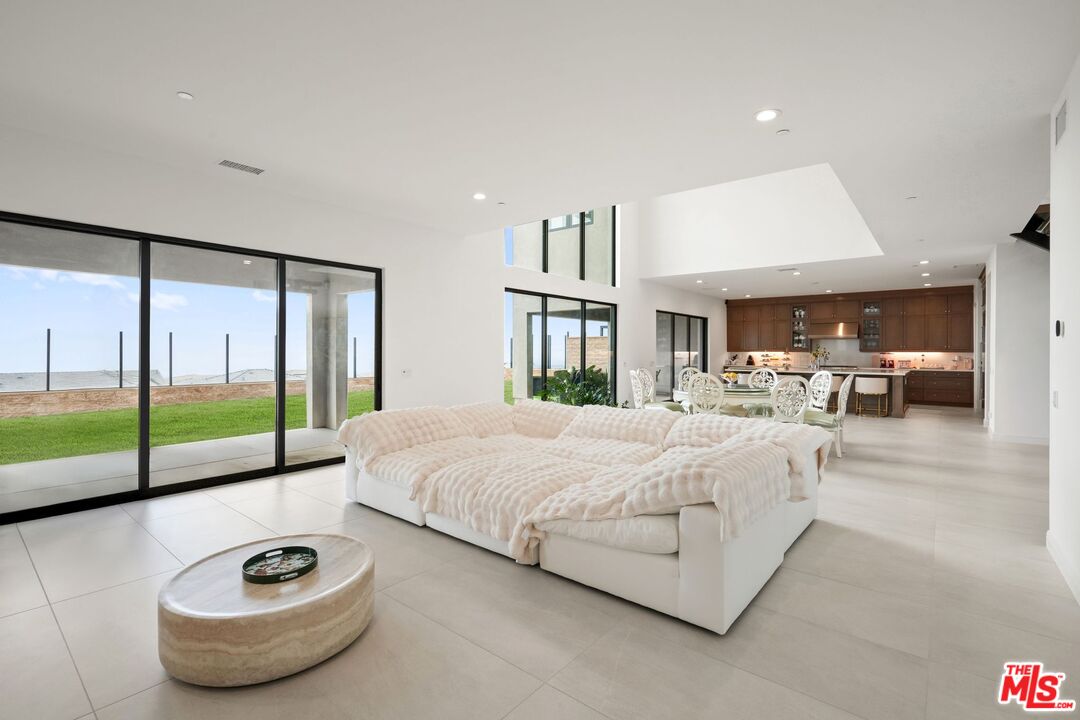 20244 Albion Way Porter Ranch, CA 91326 - Photo 19 of 47 a spacious bedroom with a bed and a large window