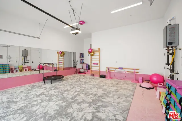 a bedroom with furniture and a flat screen tv