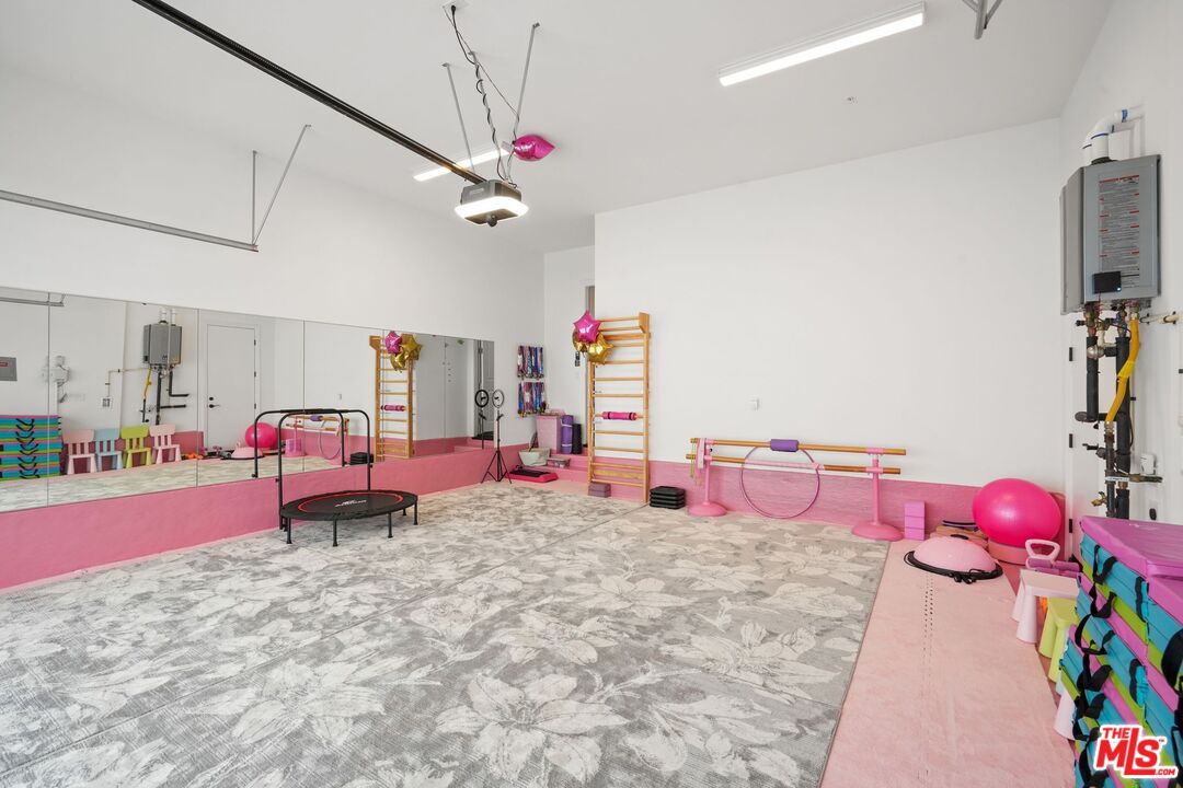 20244 Albion Way Porter Ranch, CA 91326 - Photo 20 of 47 a bedroom with furniture and a flat screen tv