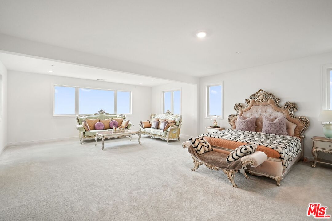 20244 Albion Way Porter Ranch, CA 91326 - Photo 21 of 47 a bedroom with two beds and a couch