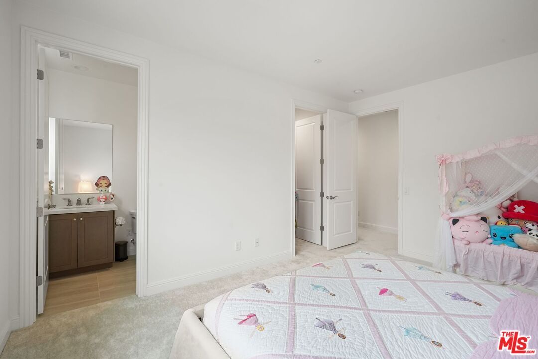 20244 Albion Way Porter Ranch, CA 91326 - Photo 32 of 47 a bedroom with a bed and a cabinets