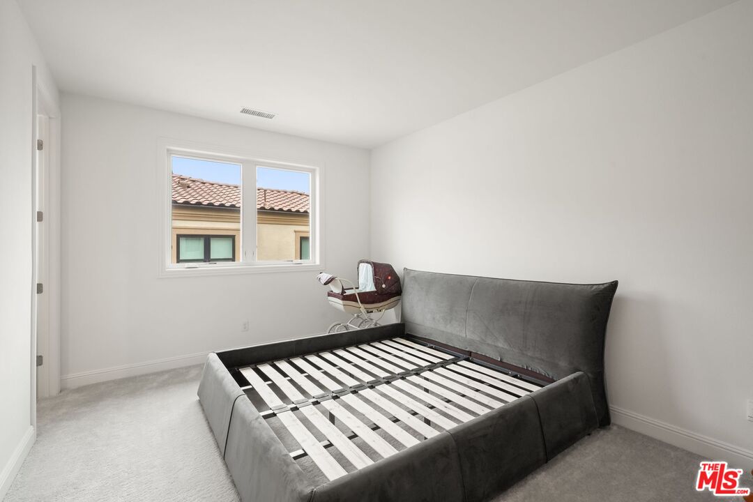 20244 Albion Way Porter Ranch, CA 91326 - Photo 33 of 47 a view of a bedroom with wooden floor