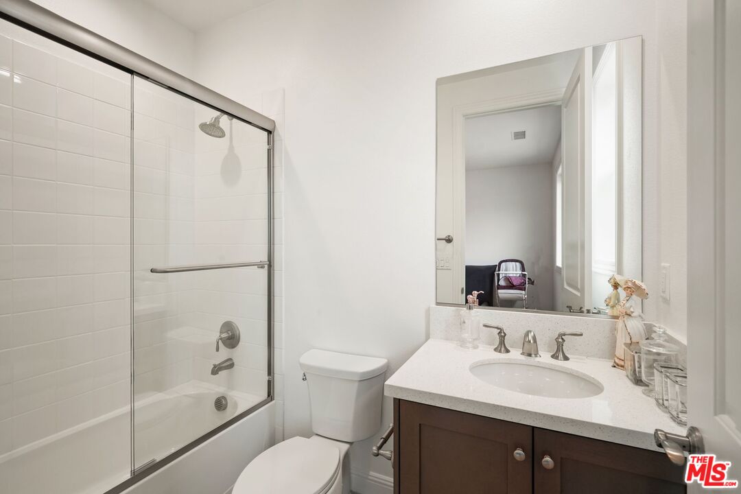 20244 Albion Way Porter Ranch, CA 91326 - Photo 34 of 47 a bathroom with a sink toilet and shower