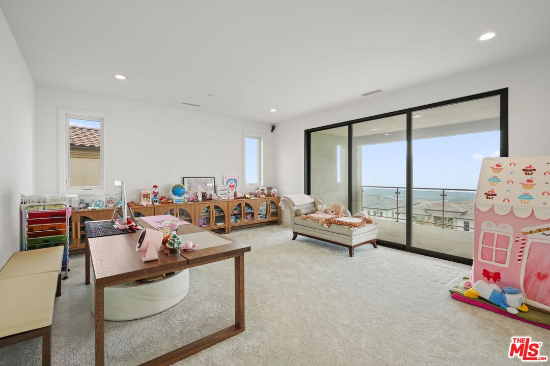 20244 Albion Way Porter Ranch, CA 91326 - Photo 35 of 47 a living room with furniture and a floor to ceiling window