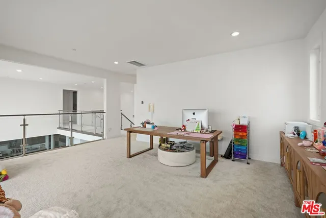 a view of a hallway with an entryway