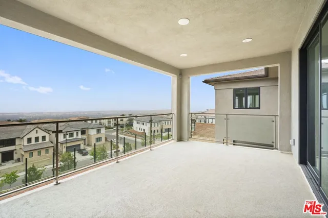 a large bedroom with a large window