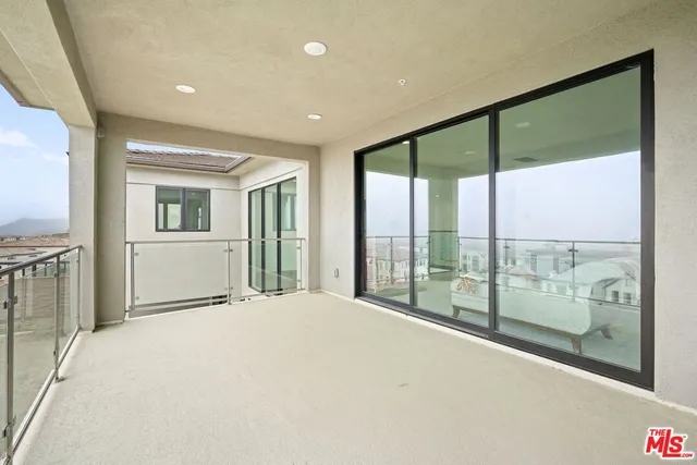 a view of entryway with stairs and wooden floor