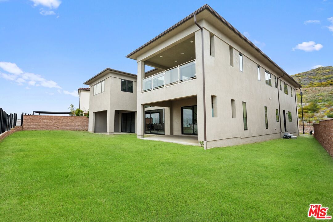 20244 Albion Way Porter Ranch, CA 91326 - Photo 42 of 47 a view of a house with a yard