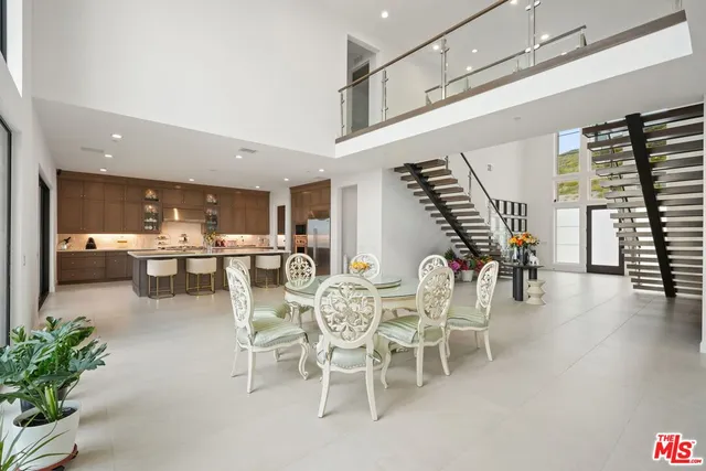 a room with lots of furniture and windows