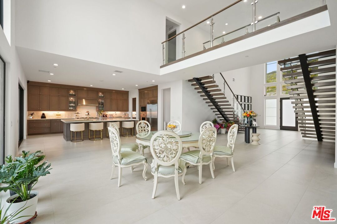 20244 Albion Way Porter Ranch, CA 91326 - Photo 5 of 47 a room with lots of furniture and windows