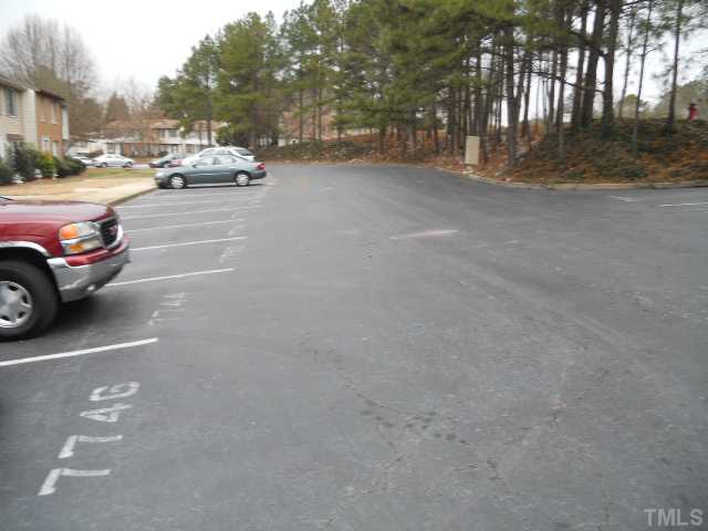 7748 Sandra Lane Raleigh, NC 27615 - Photo 2 of 8 a view of street with parked cars