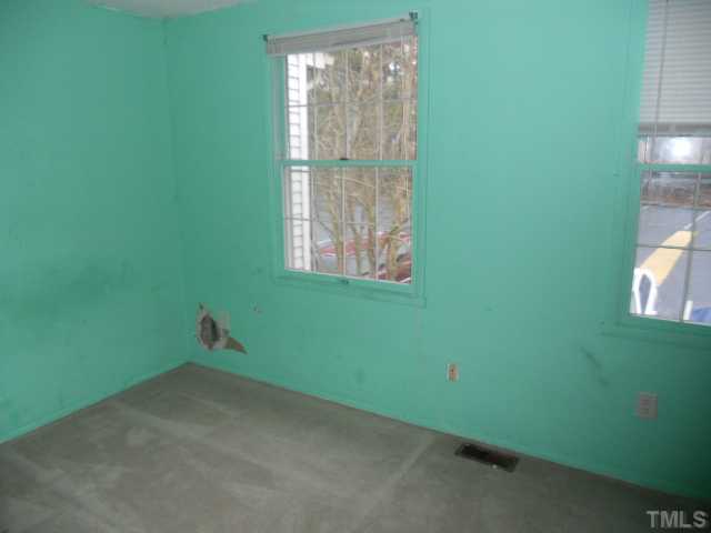 7748 Sandra Lane Raleigh, NC 27615 - Photo 8 of 8 a view of a room that has a window in it