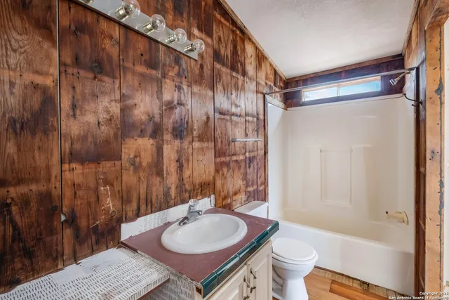 a backyard of a house with shaded area