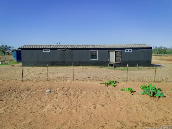 a view of a backyard of a house
