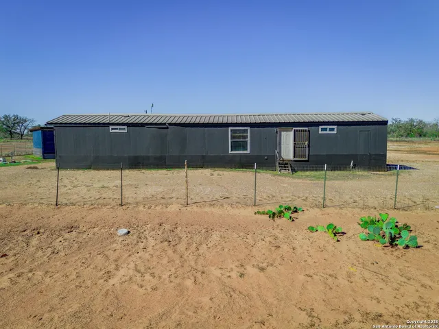 a view of a backyard of a house