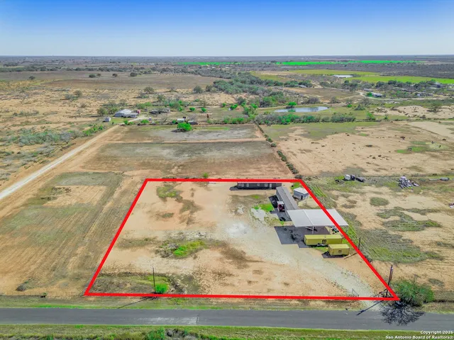 a picture of a wall with a white building