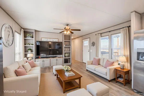 a living room with furniture and a flat screen tv