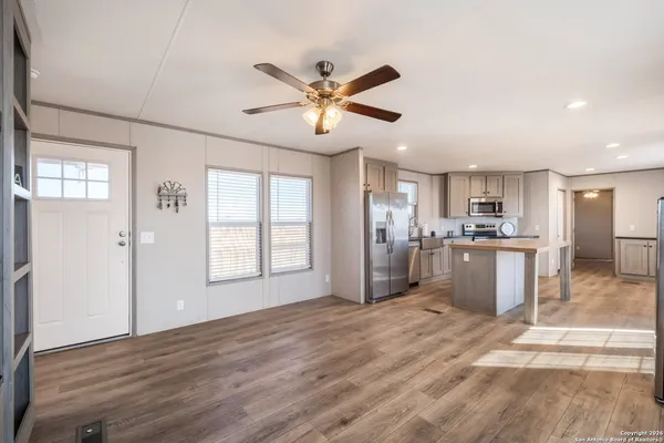 a view of a kitchen with a sink and a window