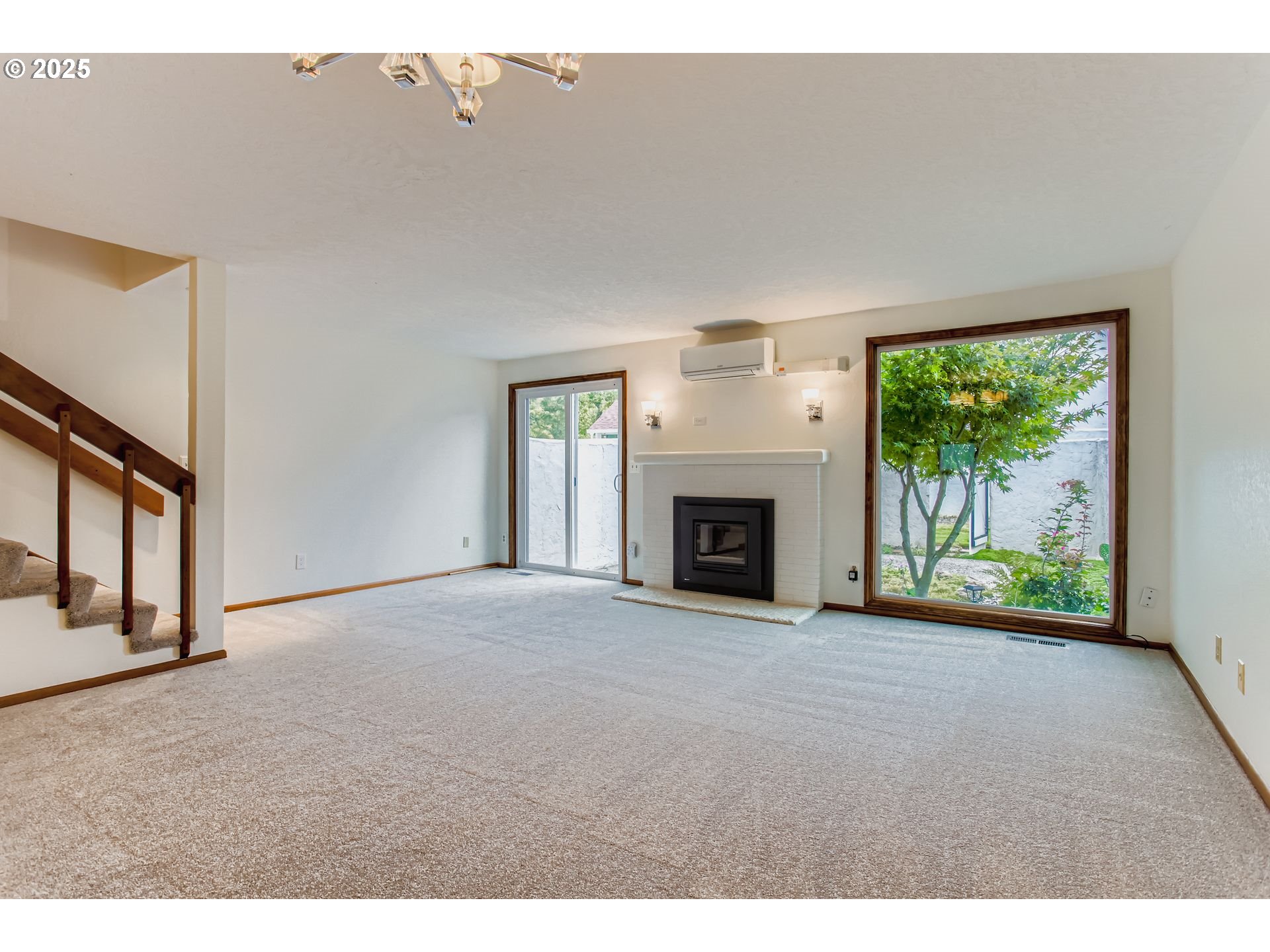 3248 Northeast 29th Street Gresham, OR 97030 - Photo 5 of 40 a view of empty room with floor to ceiling window and fireplace