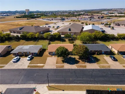 an aerial view of a house with lake view