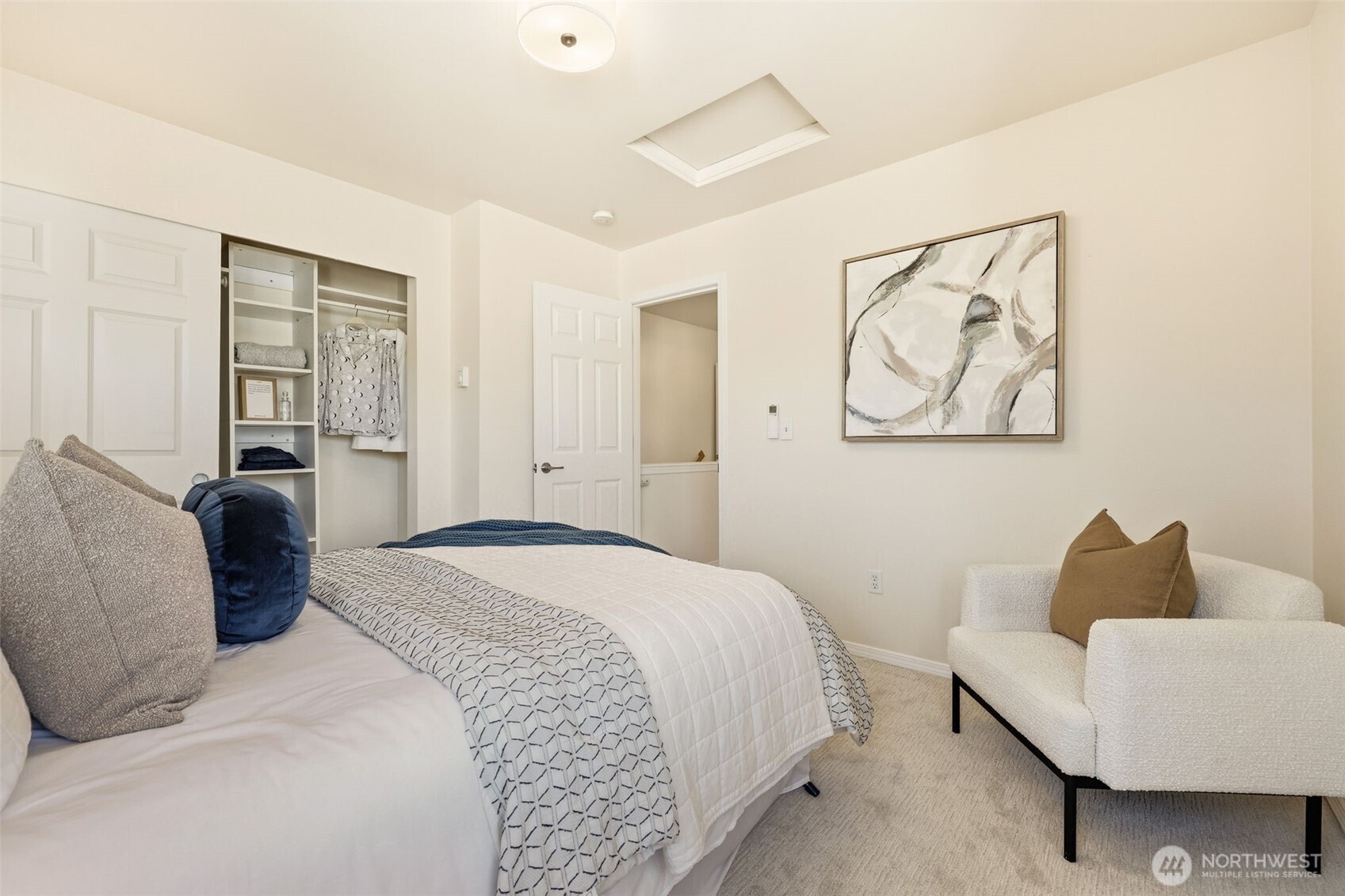 8847 9th Avenue Southwest, Unit A Seattle, WA 98106 - Photo 20 of 31 a bedroom with a bed and a couch