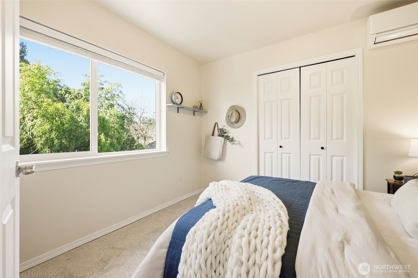 8847 9th Avenue Southwest, Unit A Seattle, WA 98106 - Photo 22 of 31 a bedroom with a bed and a window